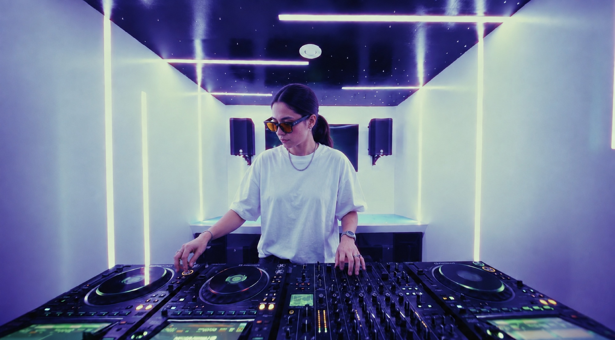 Solo DJ performing during a directed short-form session in The Portal